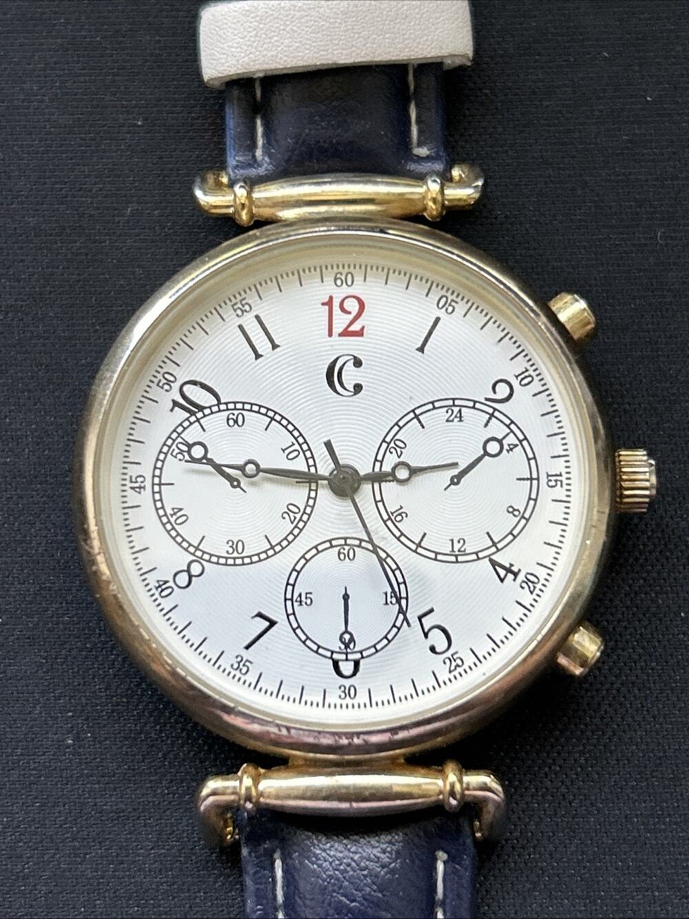 Charming Charlie Gold Tone Navy Blue Band Women’s Quartz Watch